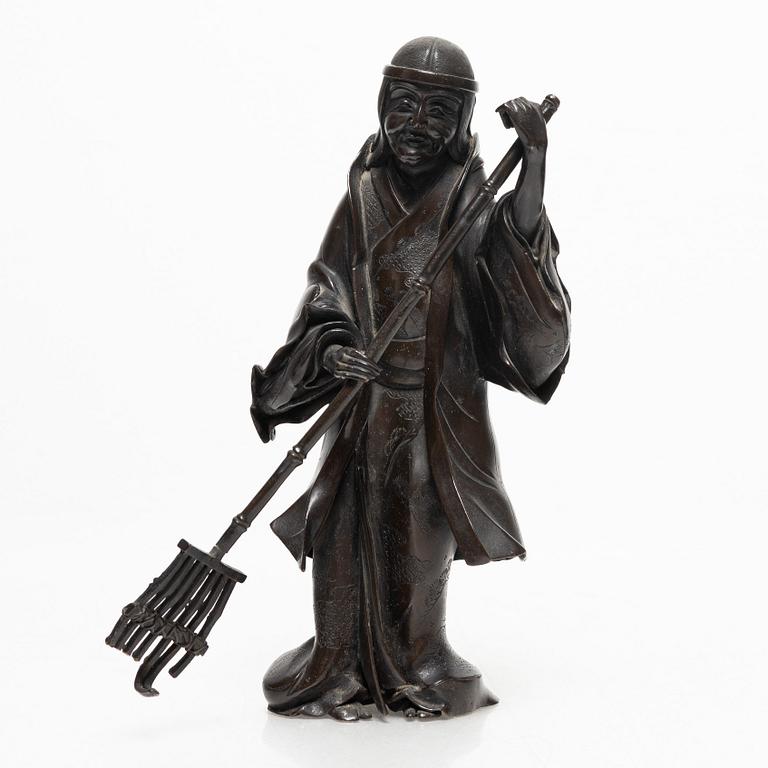 A Japanese bronze sculpture, of a gardener, Meiji period (1868-1912).