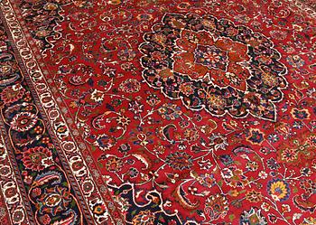 A signed Mashad carpet, ca 375 x 303 cm.