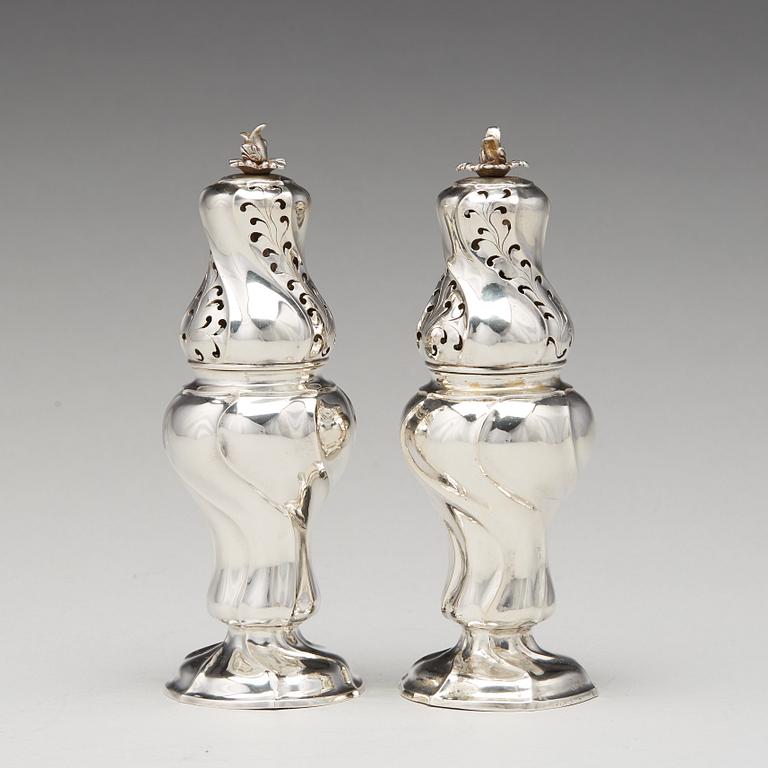 A matched pair of Swedish Rokoko silver sugar-casters, one marked Olof Gravander, Kristinehamn 1764, one a later copie.