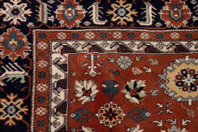 A semi-antique Orientall carpet c. 318 x 202 cm.
