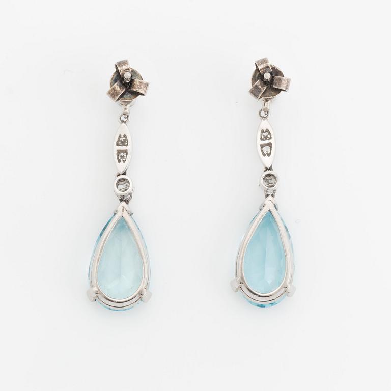 A pair of 18K white gold and aquamarine drop earrings set with round brilliant- and eight-cut diamonds.