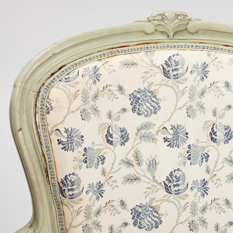 A pair of rococo-style open armchairs, 20th century.