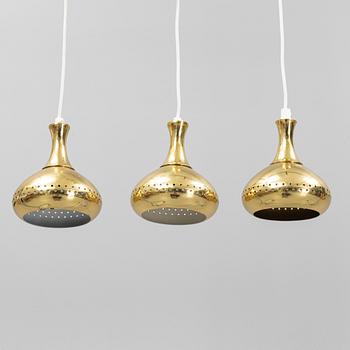 A set of three brass pendule lights, second half of the 20th Century.