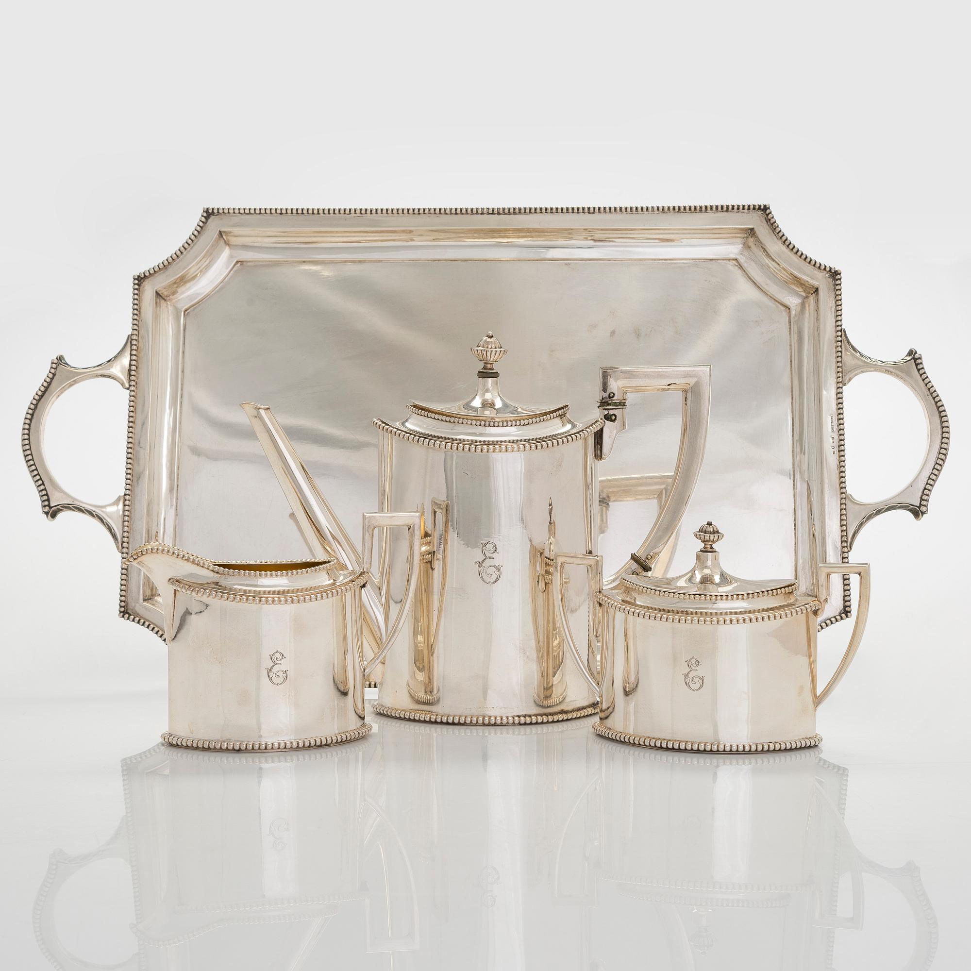 An early 20th century 4- piece sterling silver empire coffee set, C.G. Hallbergs Guldsmeds AB, Stockholm.