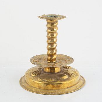 A Swedish repousse-brass baroque candlestick, circa 1700.