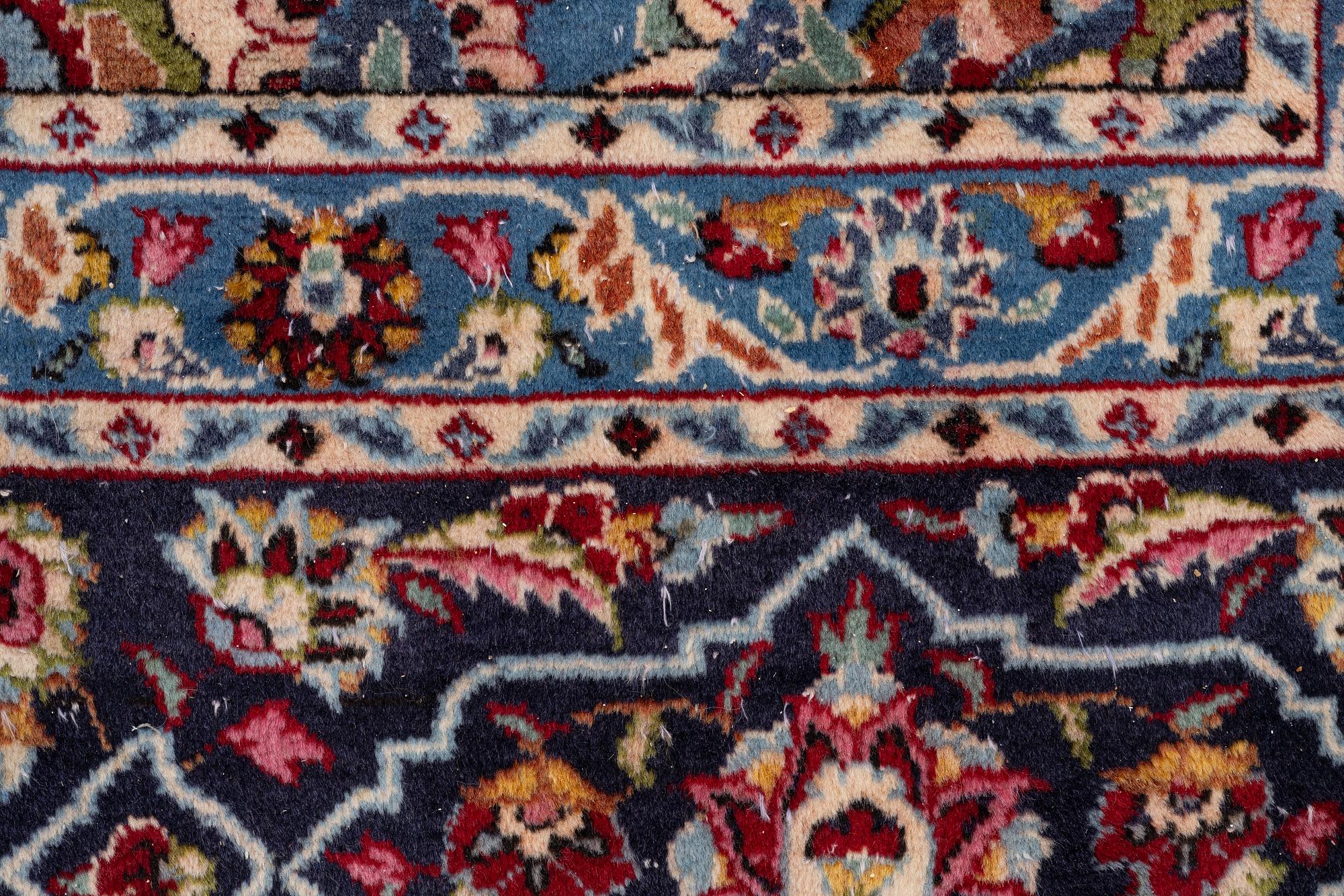 An oriental carpet, a. 419 x 295 cm.