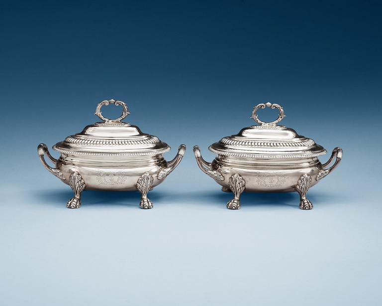 A pair of English 19th century silver sauce tureens, makers mark of Thomas Robins, London 1813-1814.