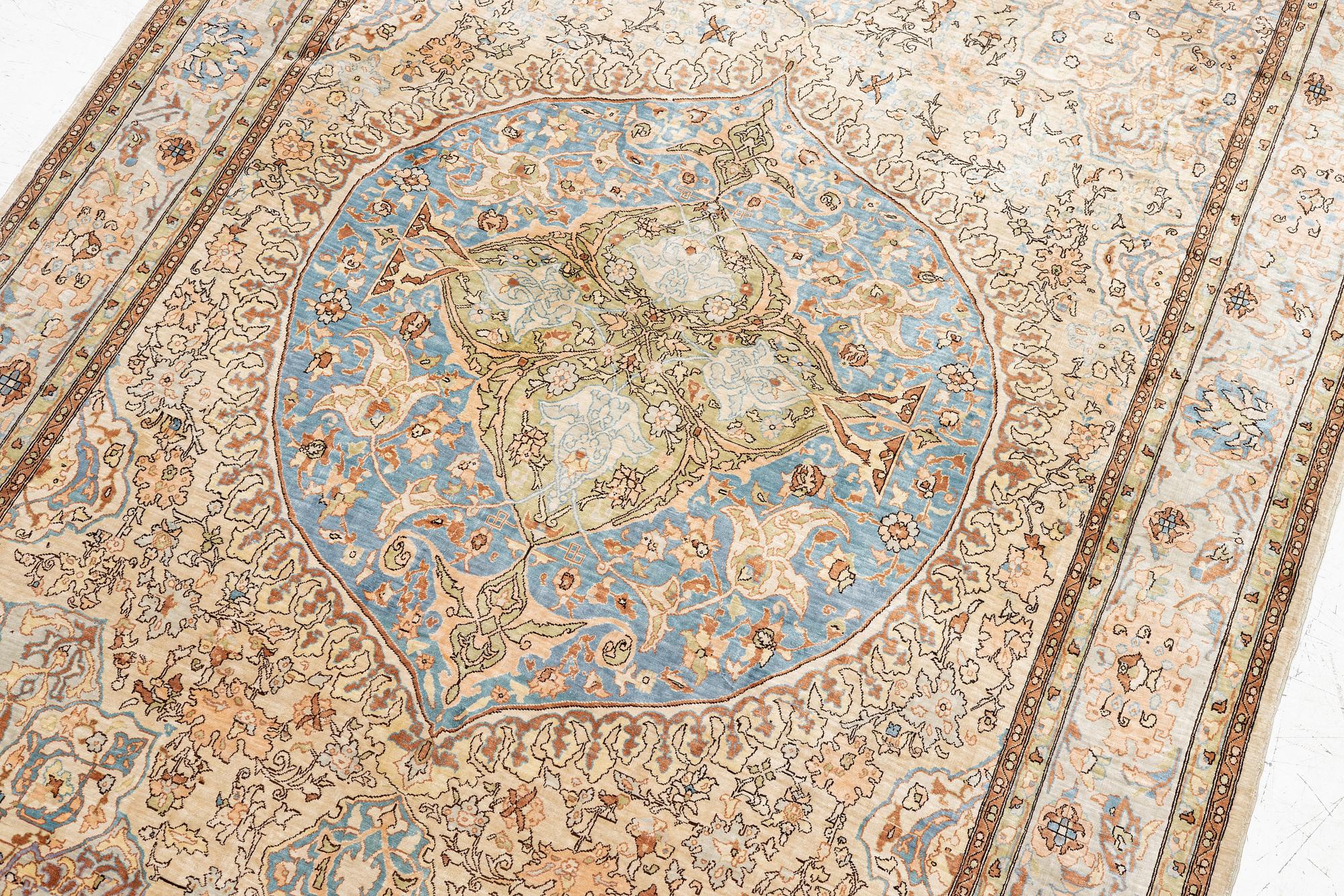 An oriental, silk rug, signed, c. 175 x 125 cm.