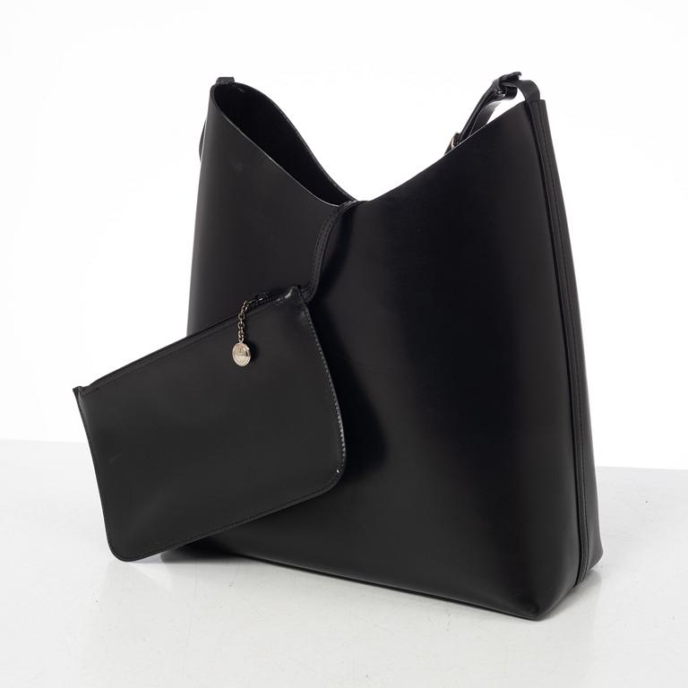 Gucci, A black leather bag.