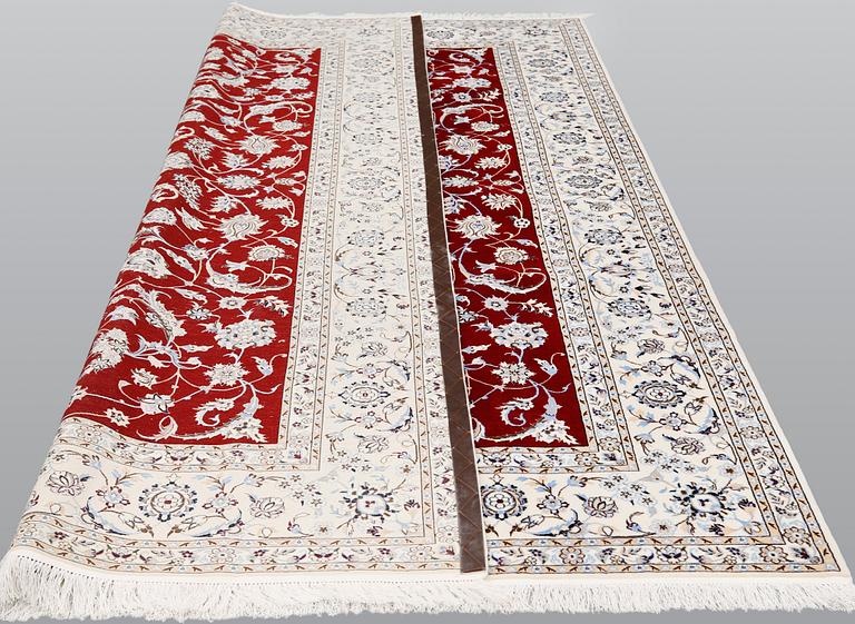 A Nain part silk carpet, 302 x 204 cm.
