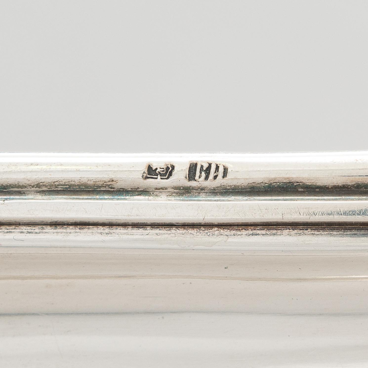 A Russian silver tray, Moscow, maker's mark IV. Unclear year mark, assay master mark Aleksandr Kudrin (1878-82).