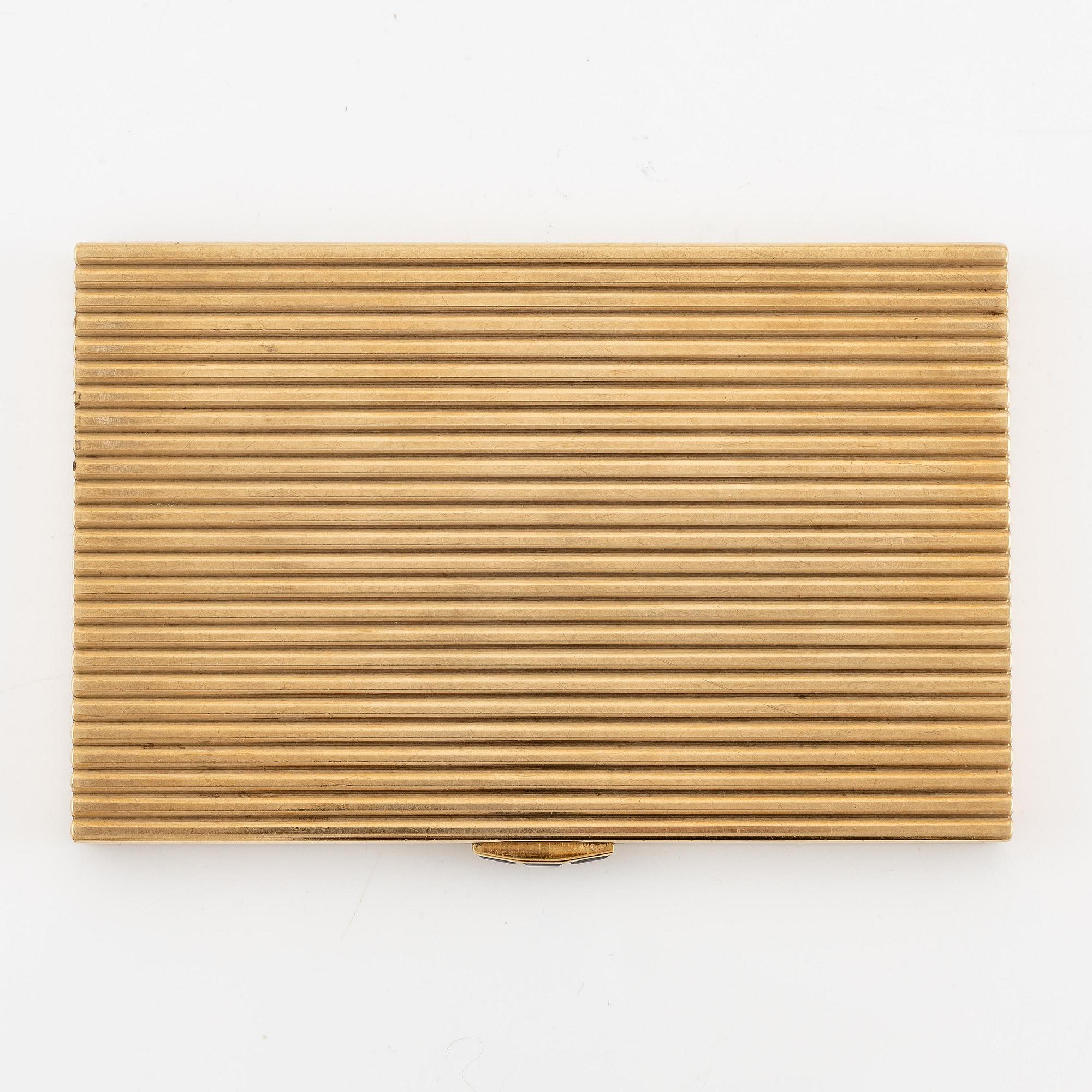 A Cartier 9 carat gold and calibré-cut sapphires cigarette case, London.