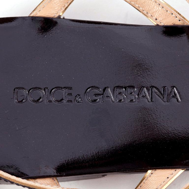 DOLCE & GABBANA, a pair of black leather sandals.