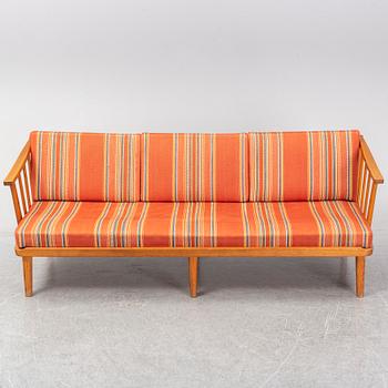 A Swedish 1960s Carl Malmsten pine wood sofa.