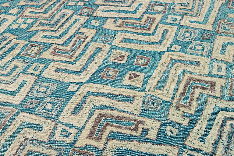 A Moroccan carpet, c. 398 x 200 cm.