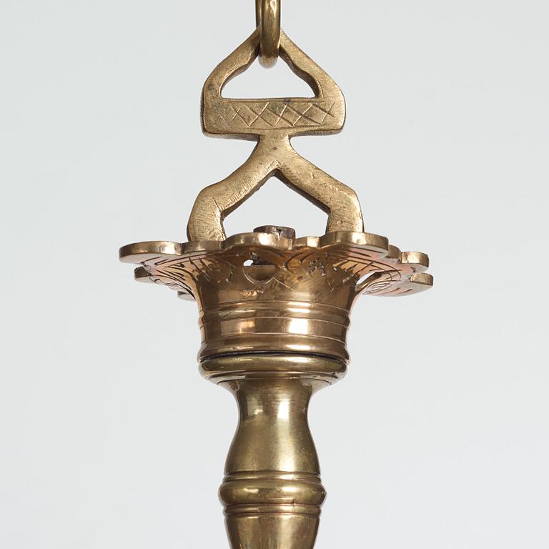 A six-light 18/19th century brass chandelier.