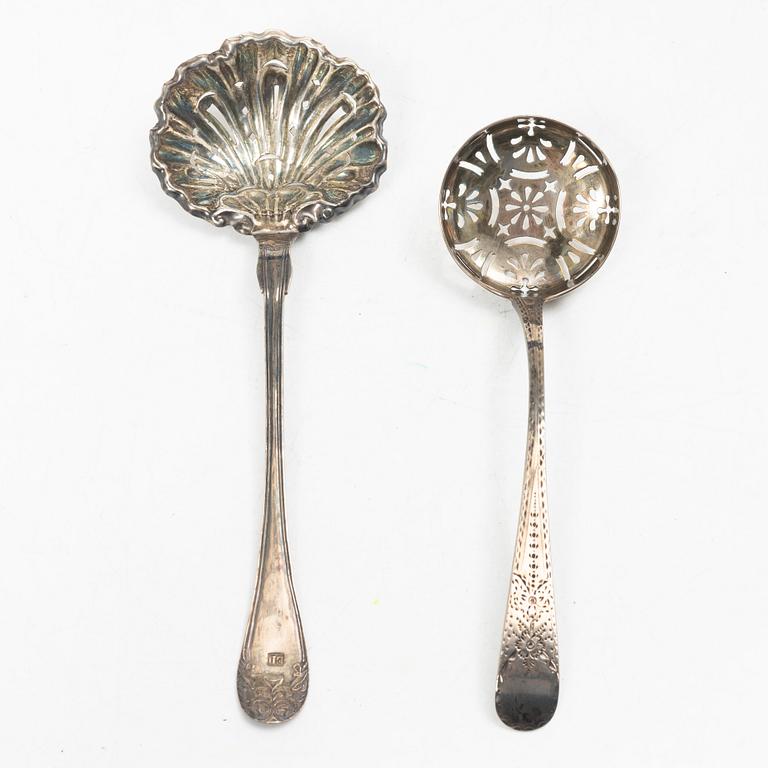 Two pierced silver bowls and two sugar spoons, including Sweden and Endland, 20th century.
