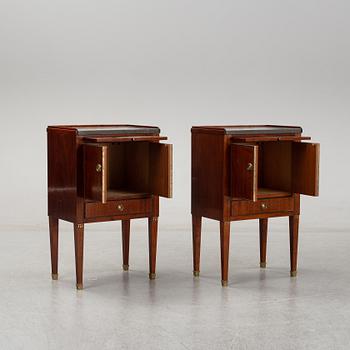 A pair of mahgany veneered bedside cabinets, early 20th Century.