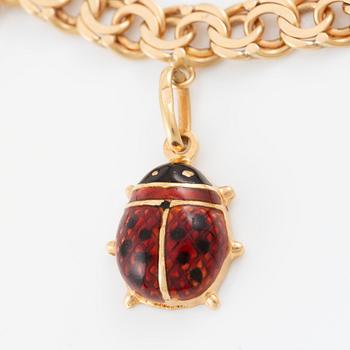 Bracelet 18K gold with charms.
