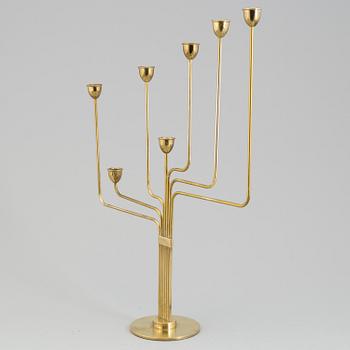 PIET HEIN, a "Ursa Major" brass candelabra, designed 1953.