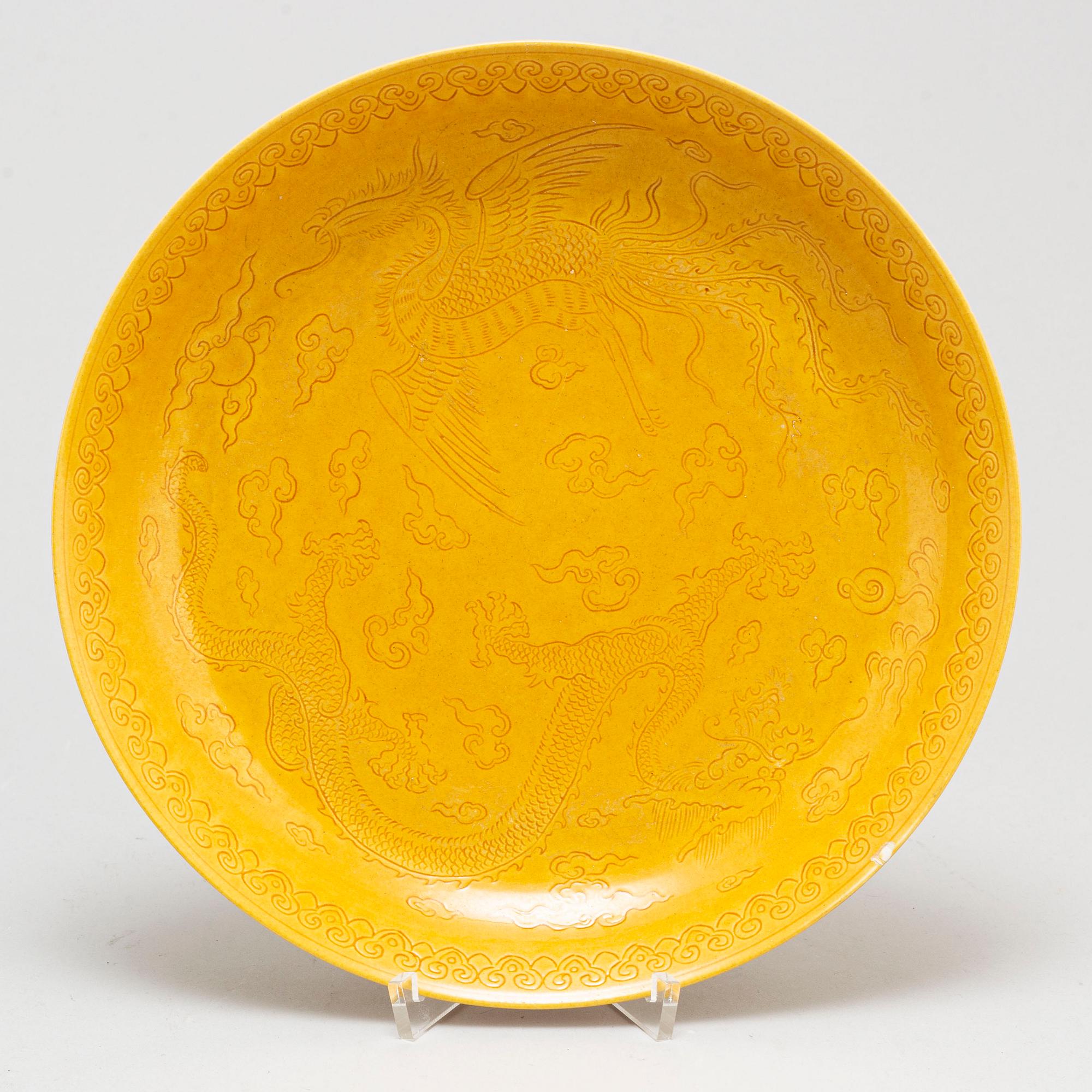 A Chinese yellow-glazed dish, 20th century.