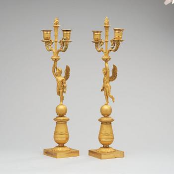 A pair of French Empire early 19th century two-light candelabra.