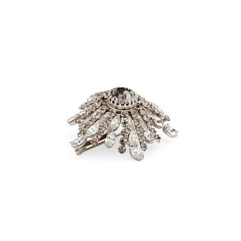 CHRISTIAN DIOR reportedly, a flower shaped brooche with decorative stones.
