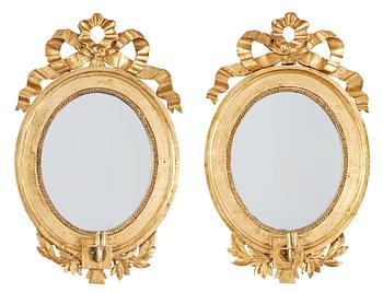 477. A pair of Gustavian late 18th century one-light girandole mirrors.