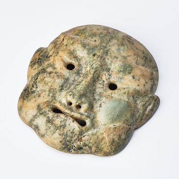 A Japanese sculptured face mask, Edo period (1603-1868).