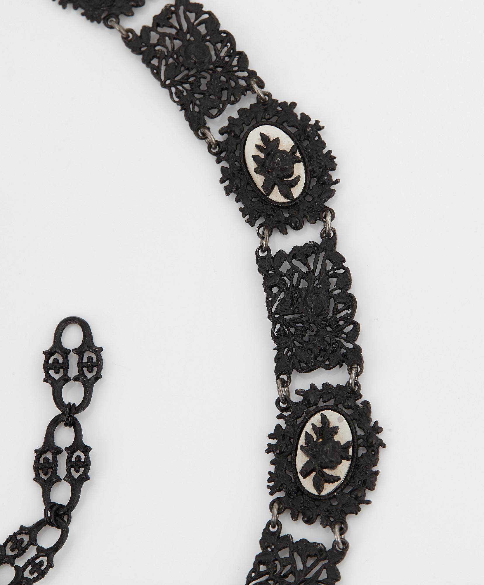 A Berlin steel and iron parure comprising a necklace, two bracelets and a brooch.