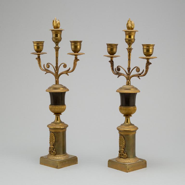 A pair of Empire bronze candelabra, first half of the 19th century.