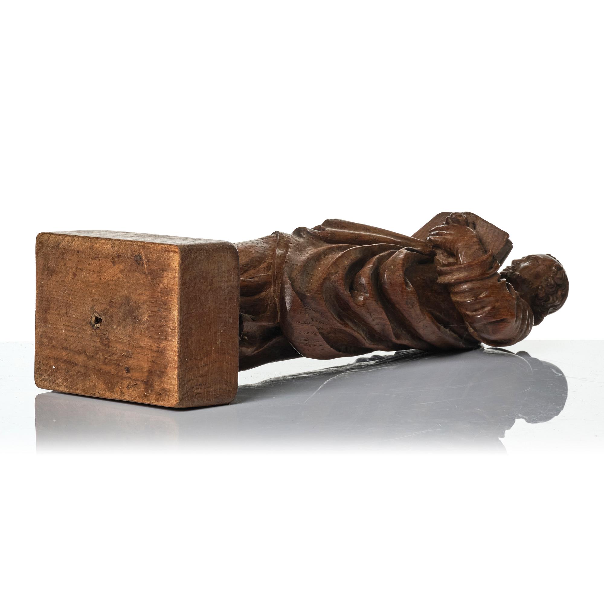 An oak sculpture of the apostle Luke, 18th/19th century.