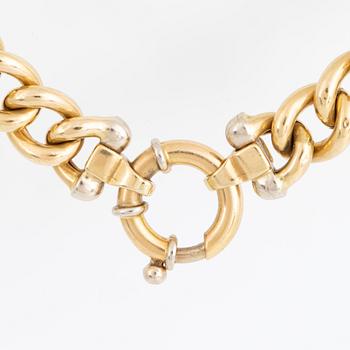 18K gold curb link necklace.