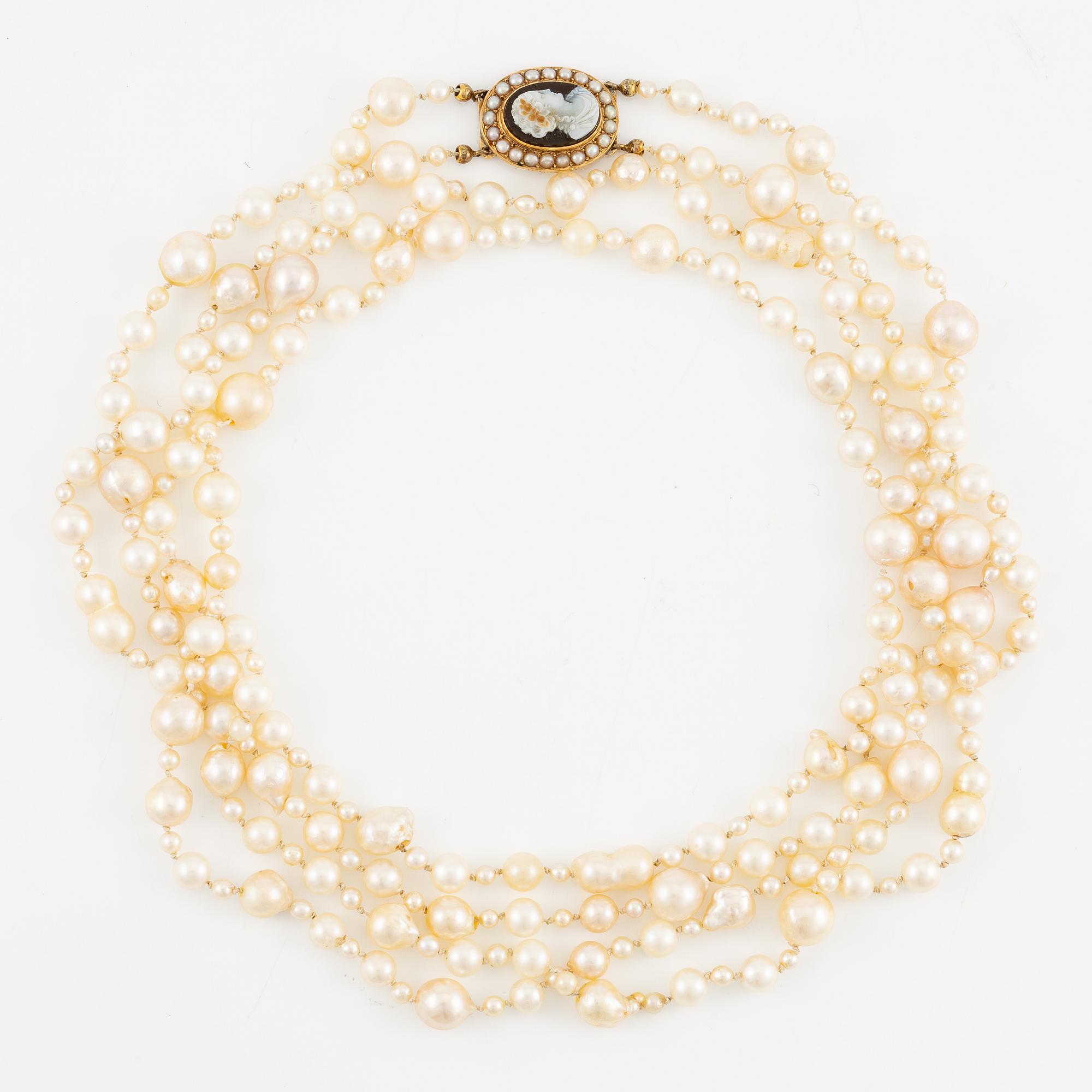 Necklace of two strands of cultured pearls, clasp 18K gold with a hardstone cameo.