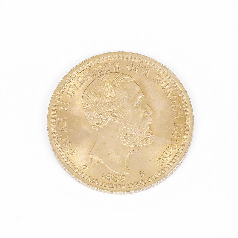 GULDMYNT, troligen omkring 20 karat. Oscar II, 20 kr. Vikt ca 8,9 gram.
