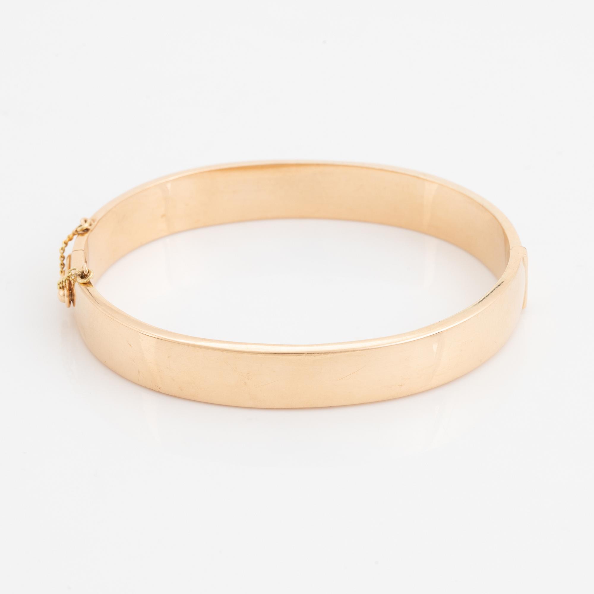 A 14K gold bracelet.