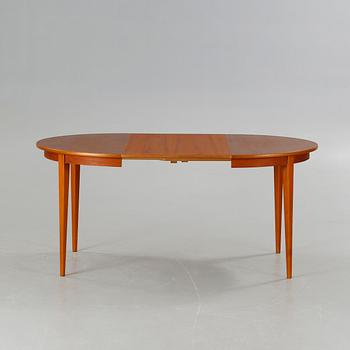 A dining table made in the middle of the 20th century.