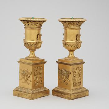 A pair of French Empire early 19th century gilt bronze urns.