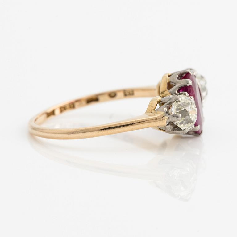 Old cut diamond and a natural ruby three stone ring.