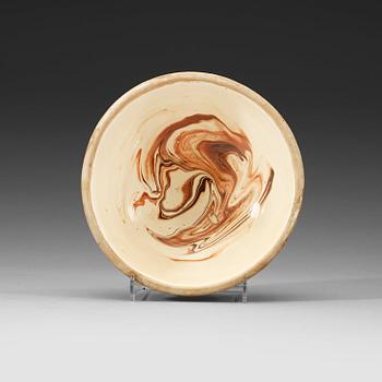 50. A marbled on white slip-glazed earthenware bowl, Song dynasty (960-1279).
