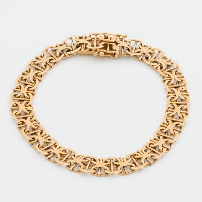 ARMBAND 18K guld x-länk med stav, Stockholm 1968.