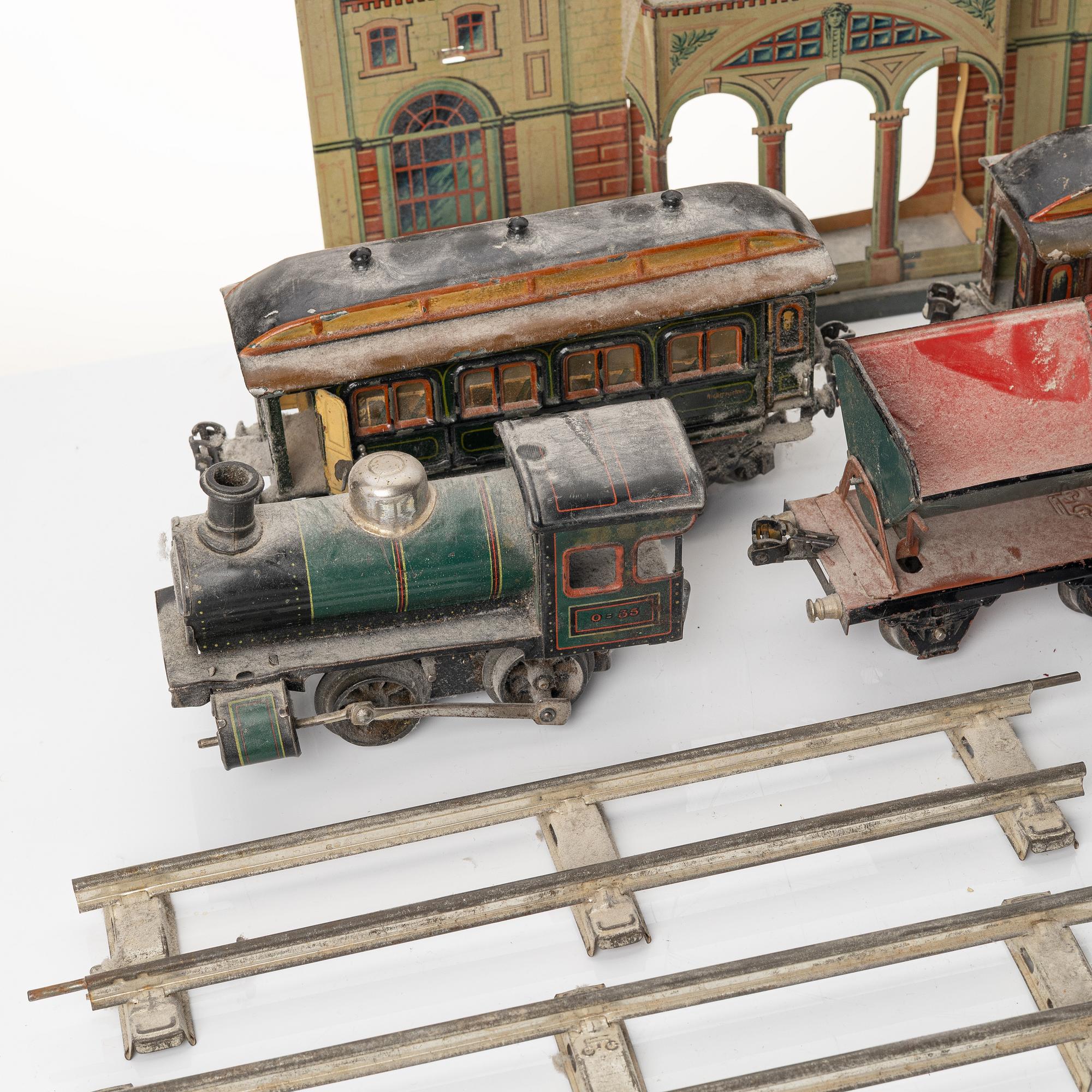 Model train with track and station building, 13 pieces, Germany, 1920s.