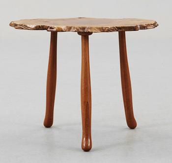 A Josef Frank elmroot and mahogany table by Svenskt Tenn.