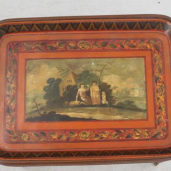 A painted tin tray 19th century with later stand.