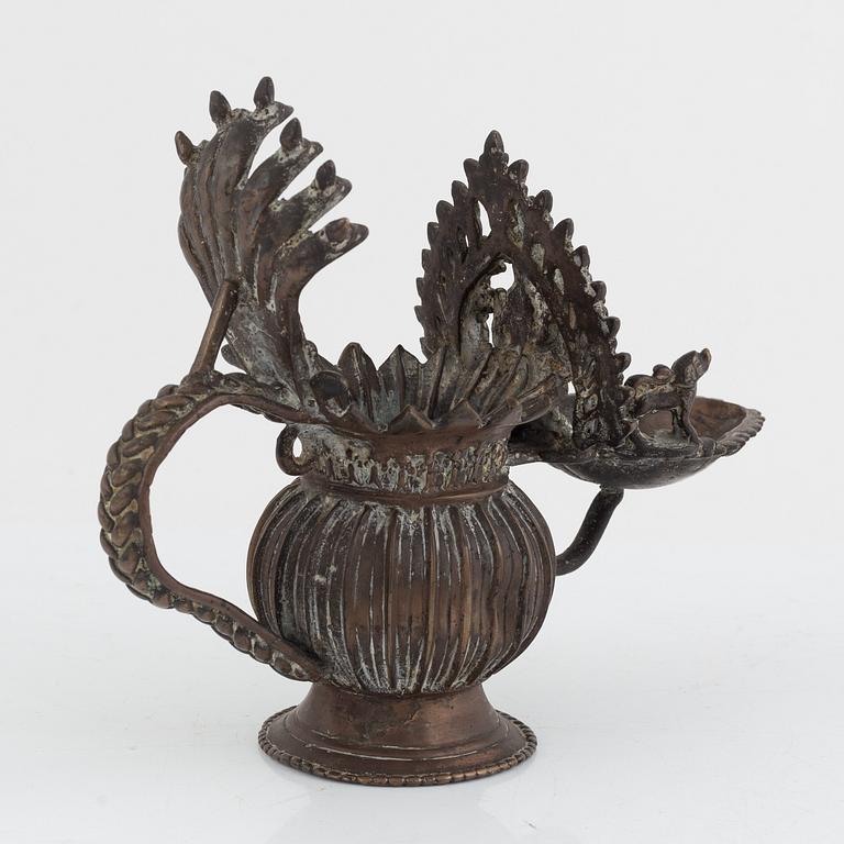 A group of three Indian bronze figures and an ewer, 20th century.