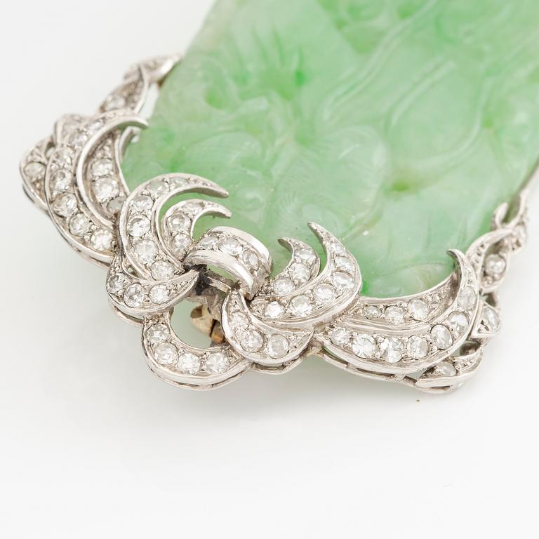 Brooch, platinum with carved jade and octagon-cut diamonds.