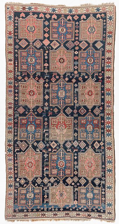 A Caucasian rug, c. 320 x 160 cm.