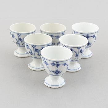 A set with six egg servers, a stand and a salt shaker, "Blue fluted"/"Musselmalet", Royal Copenhagen, part 19th century.