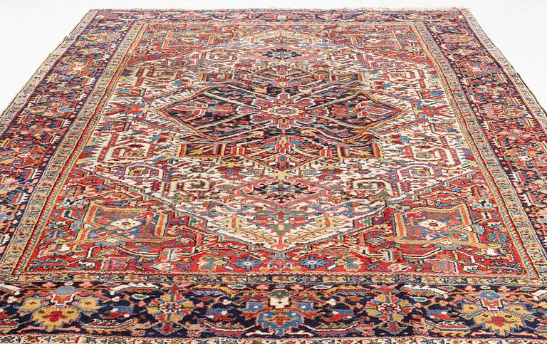 A semi antique Heris carpet, c. 345 x 255 cm.