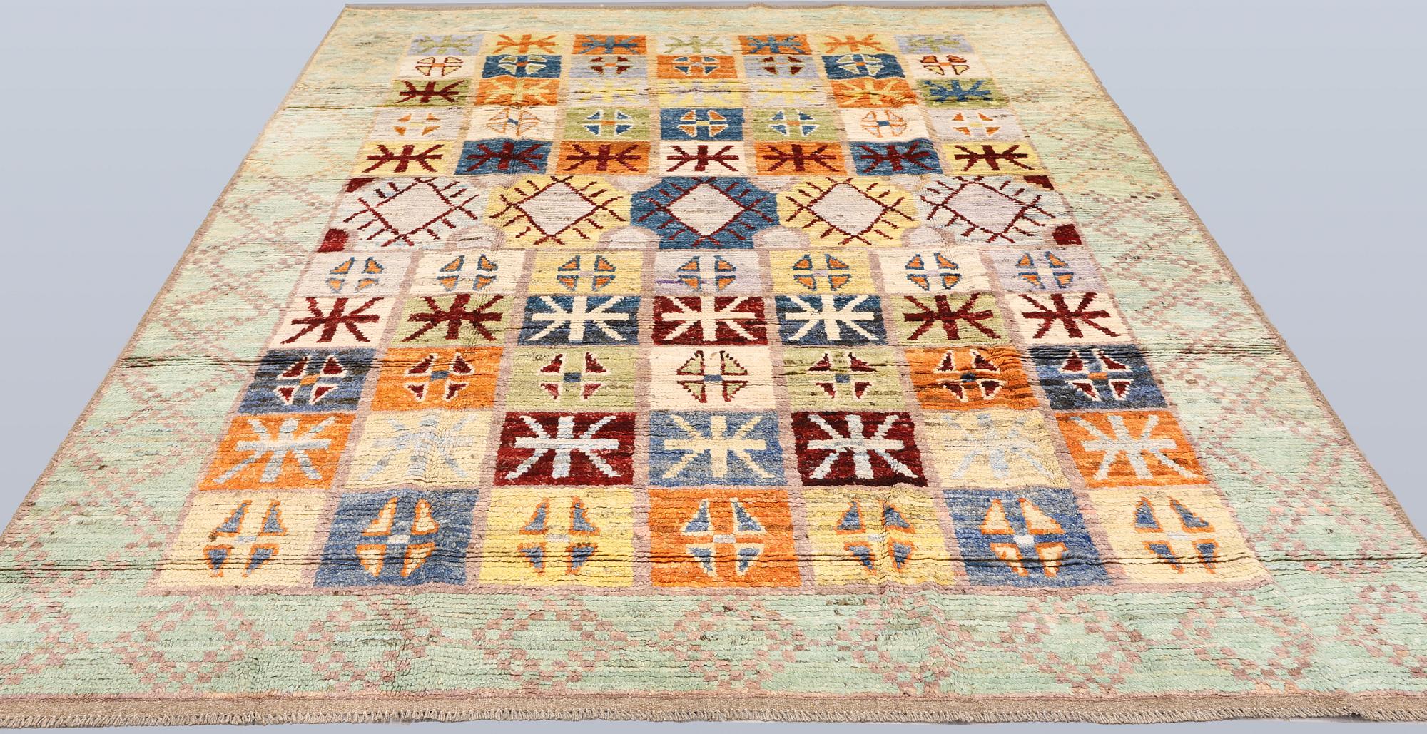 A Moroccan design carpet, c. 299 x 198 cm.
